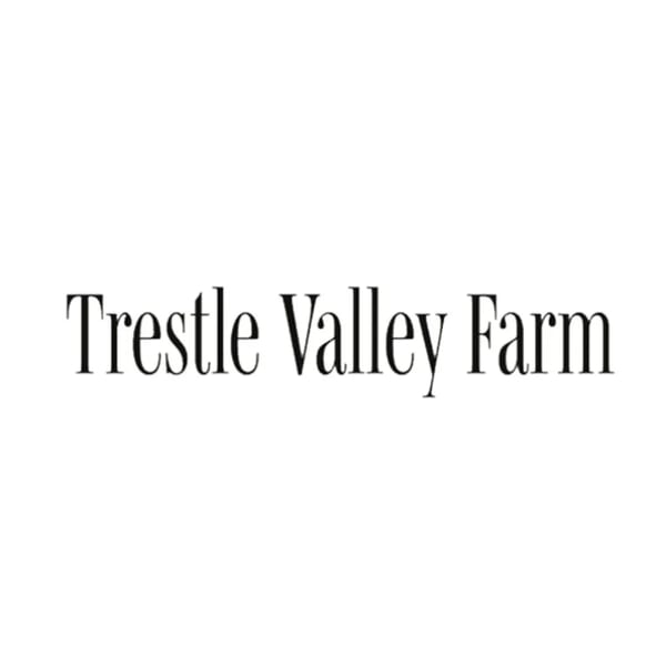The text "Trestle Valley Farm" in a classic serif font on a white background.