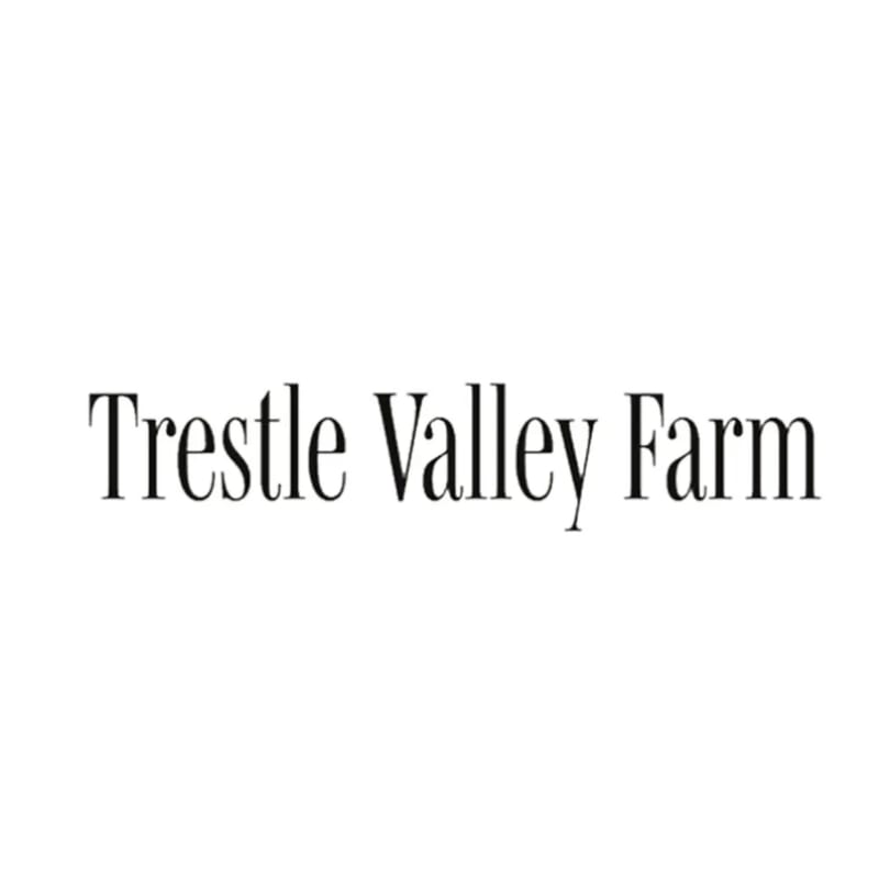 The text "Trestle Valley Farm" in a classic serif font on a white background.