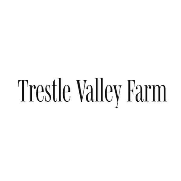 The words "Trestle Valley Farm" in a classic serif font on a white background.